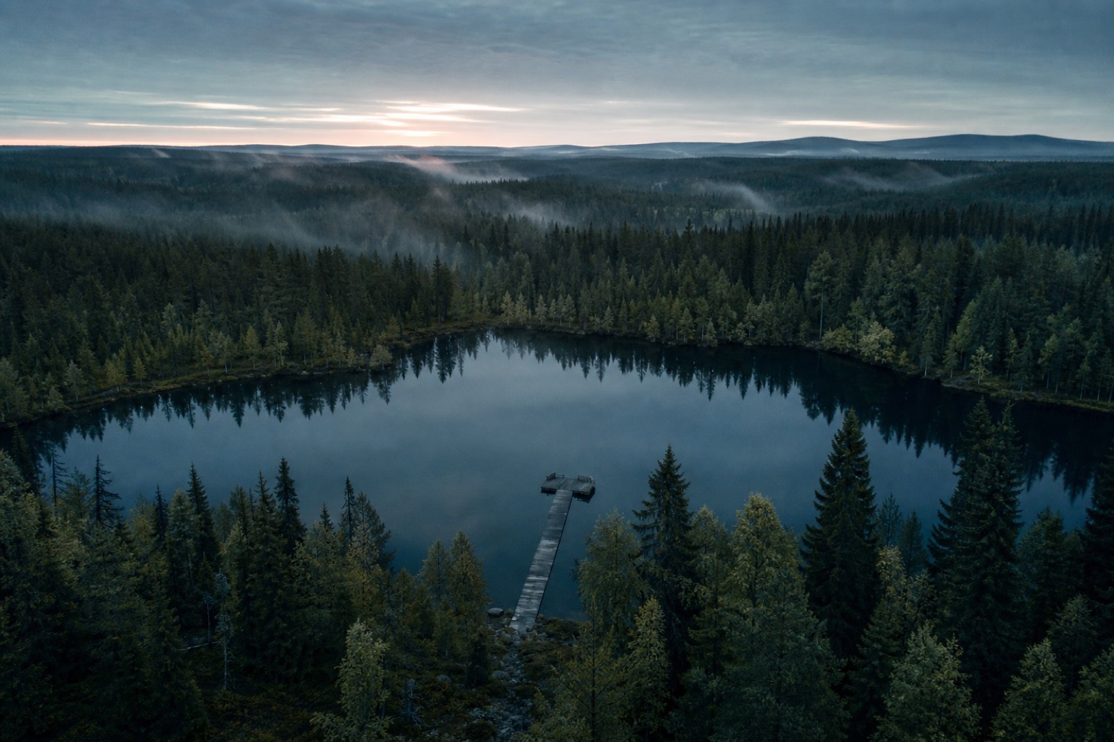 A taiga lake at dawn